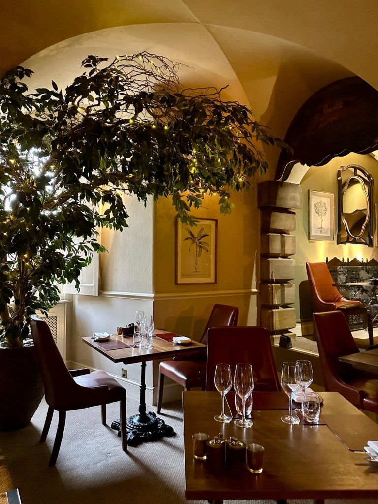 Knights Restaurant at Lumley Castle Hotel in Durham, featuring elegant table settings, candlelight, and historic stone interiors.