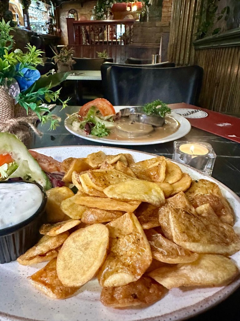 Golden crispy potato skins starter at Pacino’s South Shields served with creamy garlic mayonnaise dip.