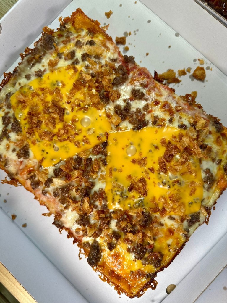 Slab Shop Mac Daddy Detroit pizza topped with ground beef, melted American cheese and crispy onions.