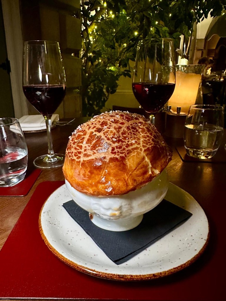 French onion soup with golden bread crust served at Knights Restaurant in Lumley Castle Hotel.
