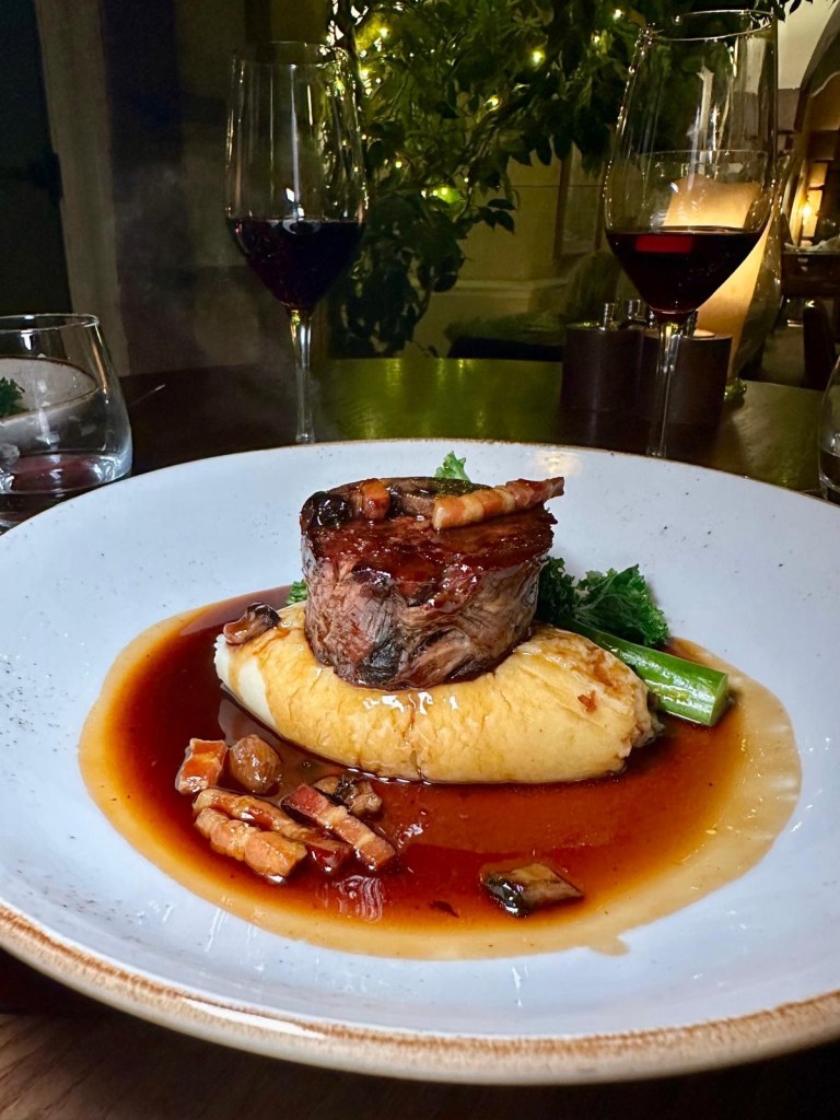Slow-cooked feather blade beef served with rich gravy and vegetables at Knights Restaurant.