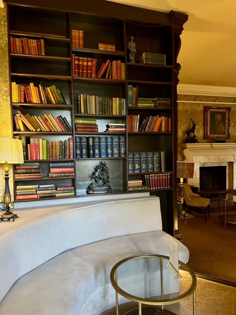 Elegant hallway with period decor and antique furnishings at Lumley Castle in Durham.