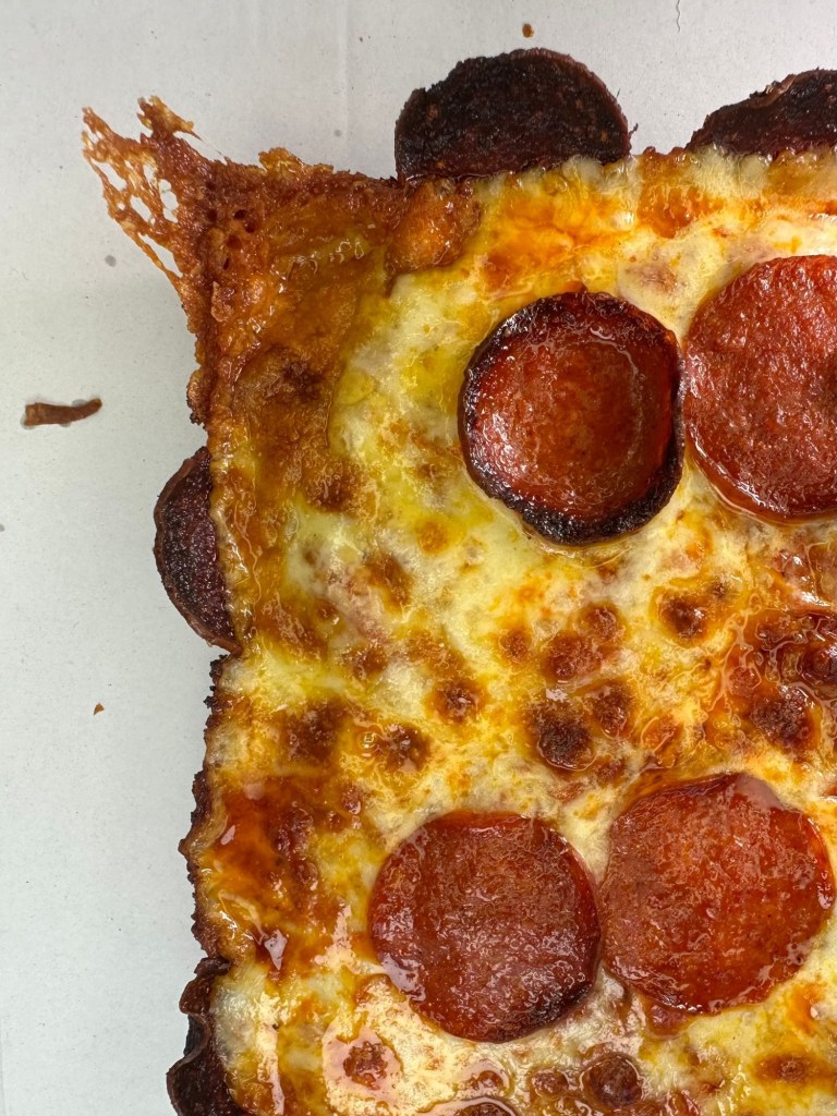 Slab Shop Double Down pizza with layers of double pepperoni and a crispy pepperoni crust.