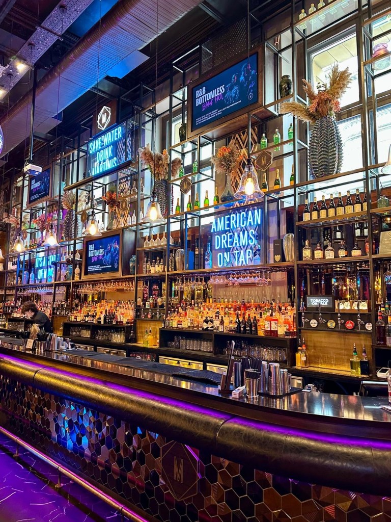 Long, warm and inviting bar at Manahatta, Newcastle