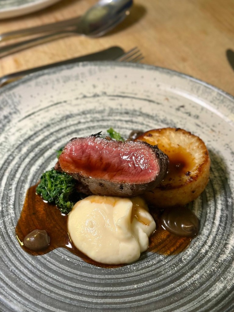 Loin of venison with celeriac fondant, pickled walnuts and rich jus.