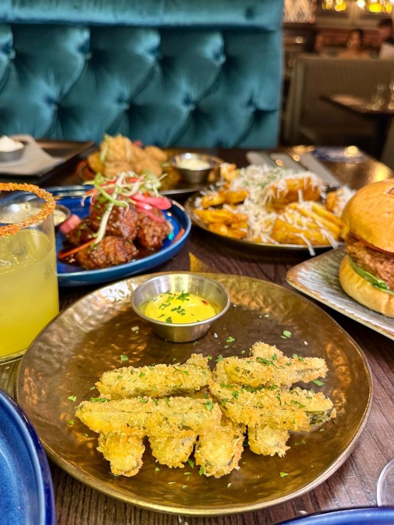 Assorted Manahatta Newcastle small plates on the table, featuring crispy bites, seasoned seafood and sharing-style dishes.