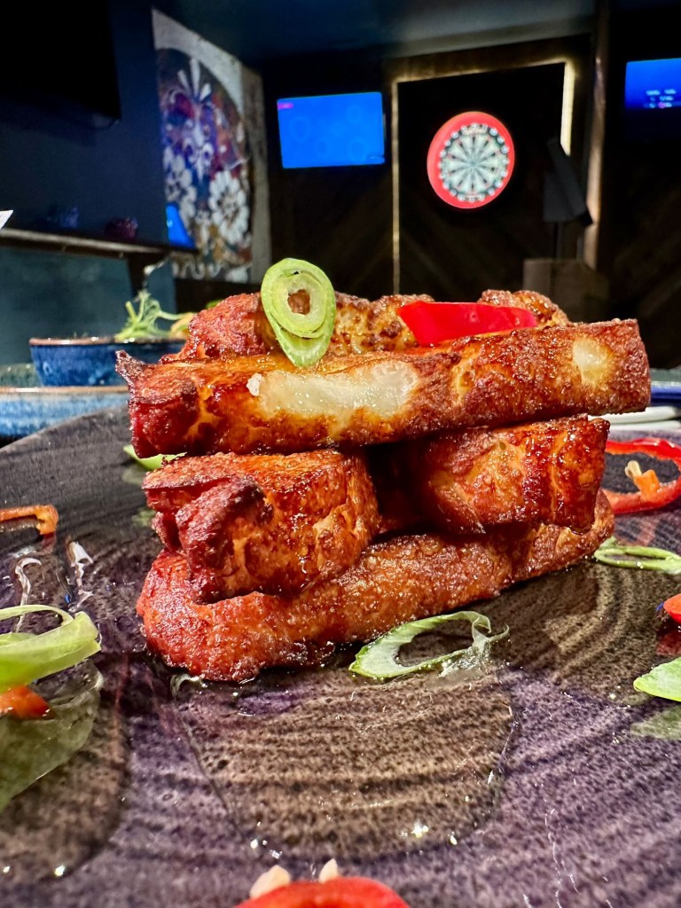 Fried halloumi topped with hot honey sauce at Bullseye Social Darts Jesmond.