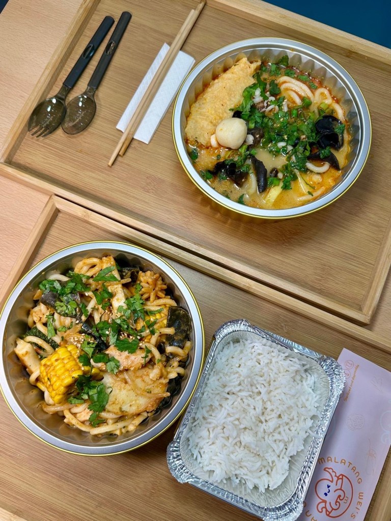 A variety of fresh seafood ingredients, including prawns, fish balls, squid, and mussels, ready to be added to a Malatang hot pot.