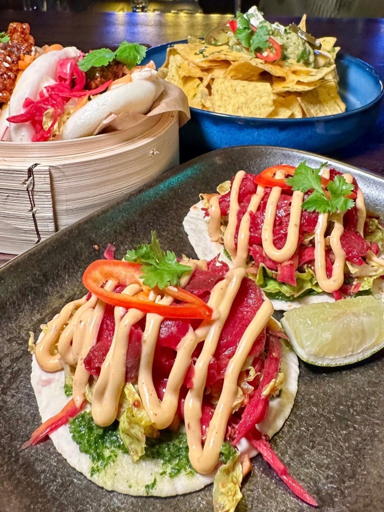 Tacos at Manahatta Newcastle filled with seasoned toppings, fresh salsa and garnishes.