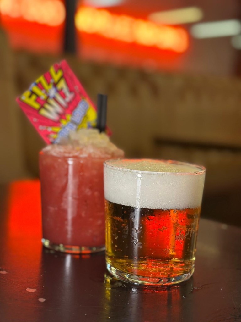 Selection of drinks from pizza punks, including a 0% craft beer and popping candy mocktail