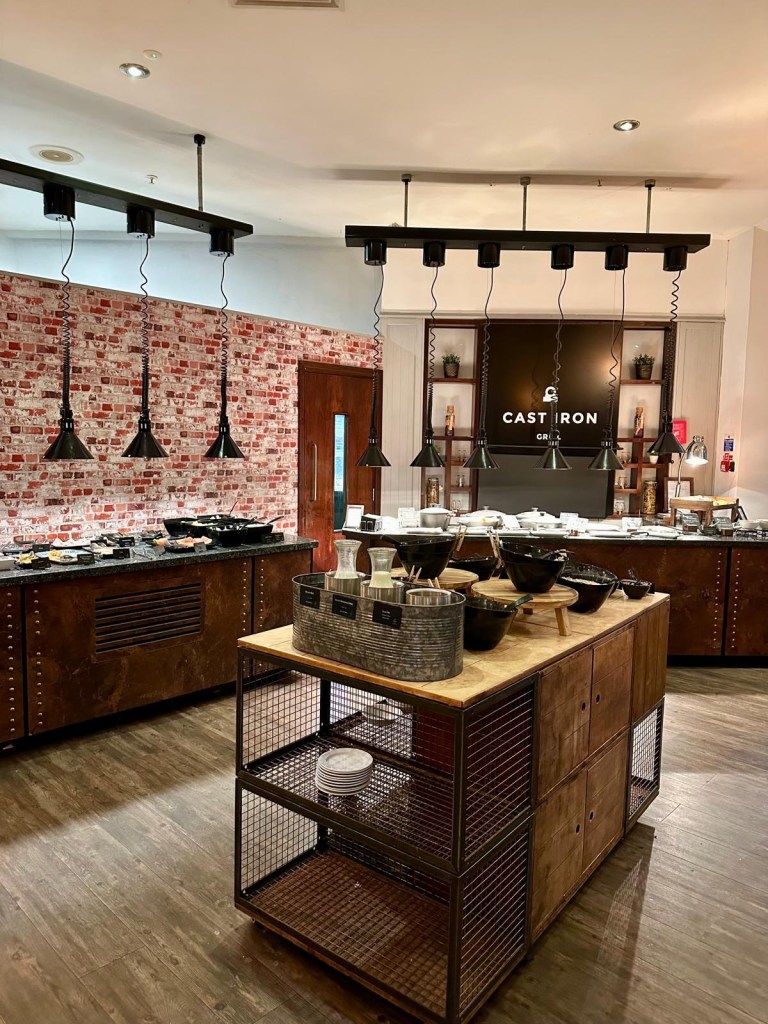 Full breakfast dining area at Delta Hotels by Marriott Newcastle Gateshead with buffet setup and modern seating.