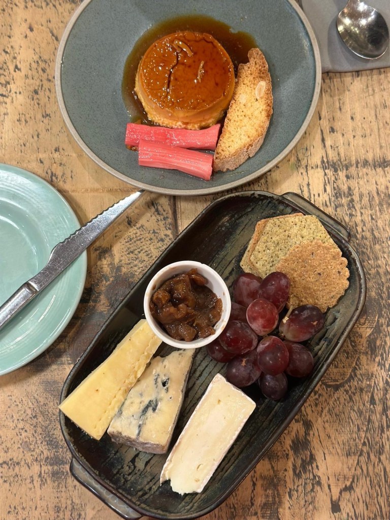Crème caramel with poached rhubarb and English cheese board desserts at Hinnies Whitley Bay
