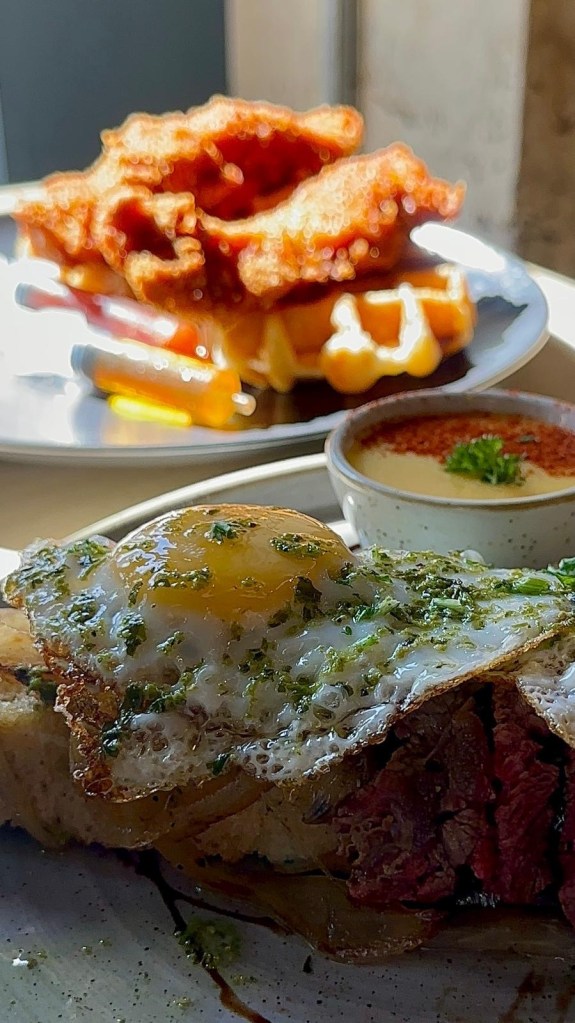 Brunch spread with French toast, chicken and waffles and steak and eggs at The Dispensary Newcastle