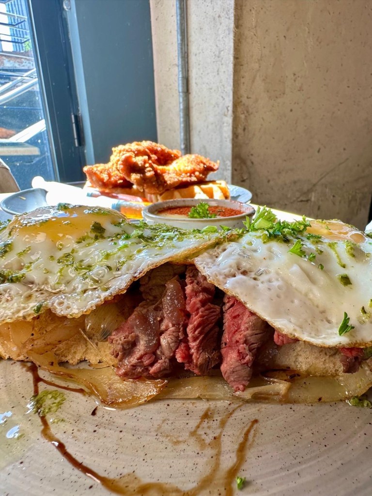 Steak and eggs on focaccia with hollandaise at The Dispensary Newcastle