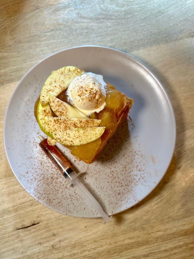 Apple cinnamon crumble French toast with maple syrup and vanilla ice cream at The Dispensary Newcastle