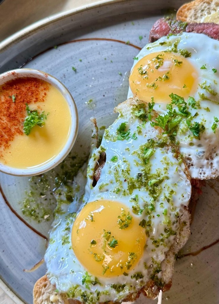 Steak and eggs on focaccia with hollandaise at The Dispensary Newcastle