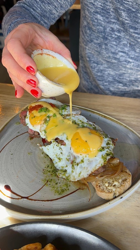 Steak and eggs on focaccia with hollandaise at The Dispensary Newcastle