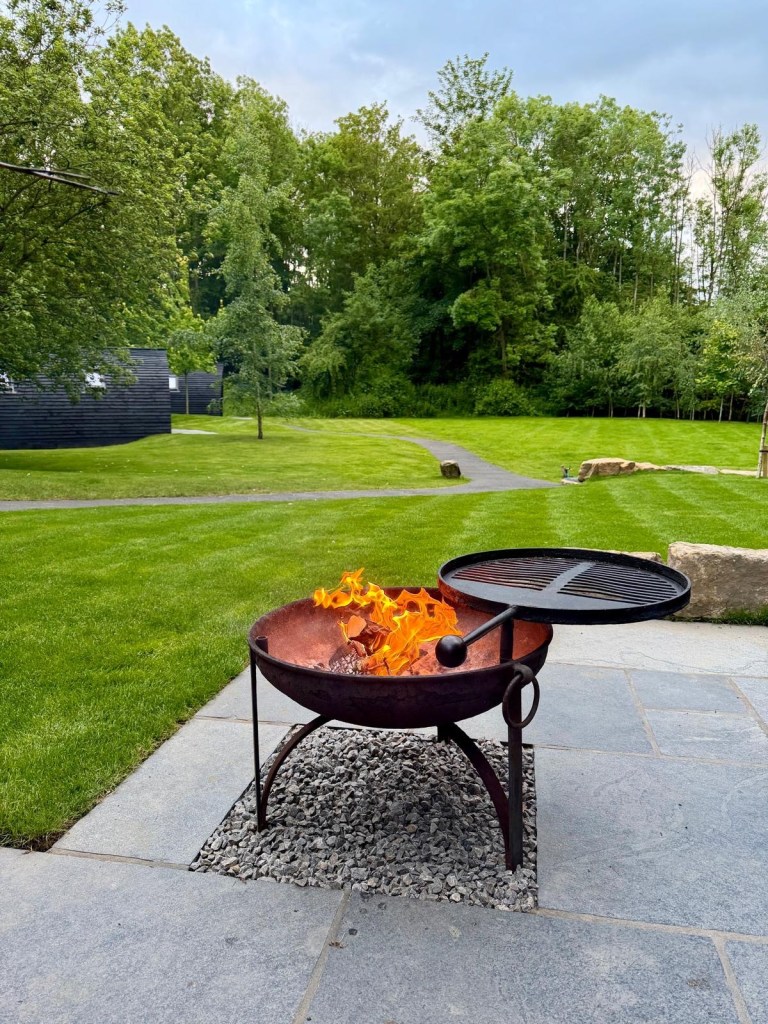 Cosy evening around the fire pit at Hewn Yorkshire countryside cabin