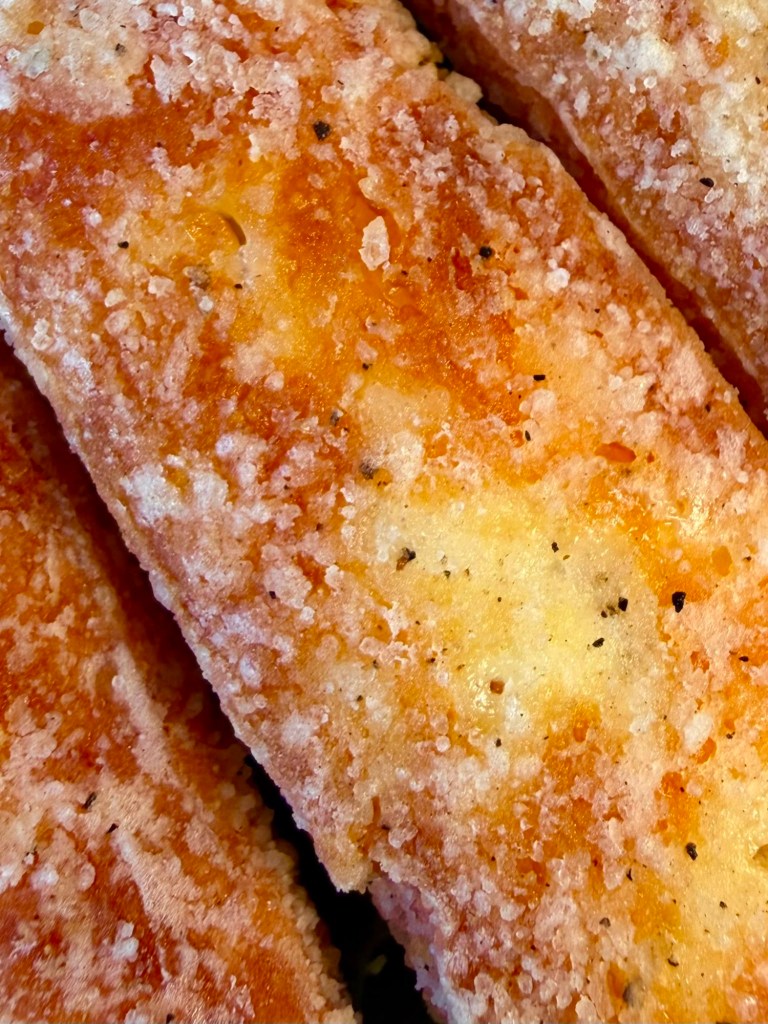 Close up of crispy halloumi fries with sweet chilli dip at The Queen's Head Cullercoats