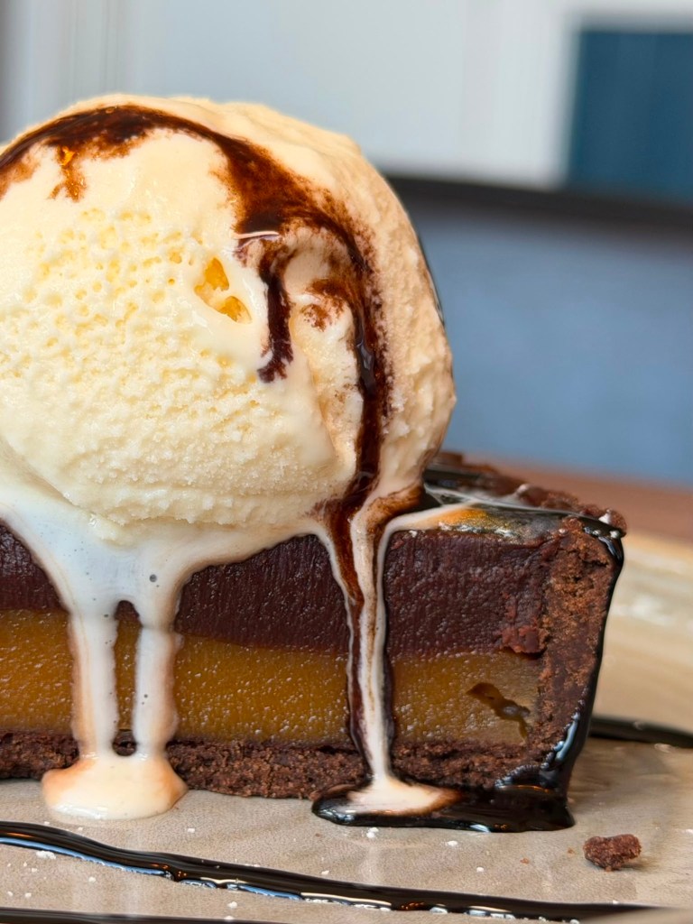 Chocolate tart with ice cream and chocolate drizzle at The Queen's Head Cullercoats